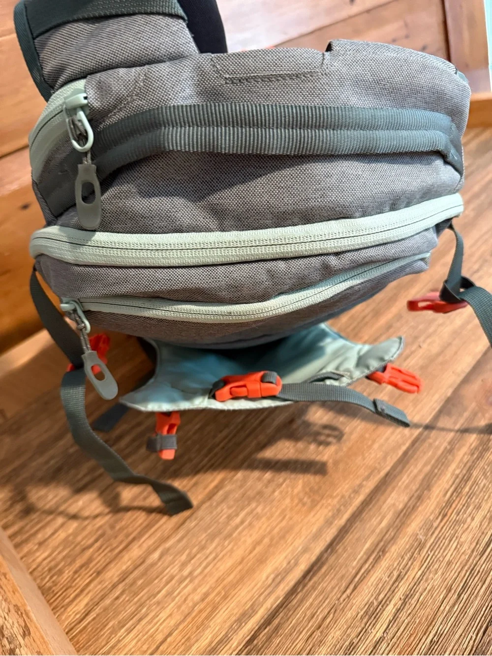 Dakine Mint tinted heli pack 12 backpack with Orange Buckles